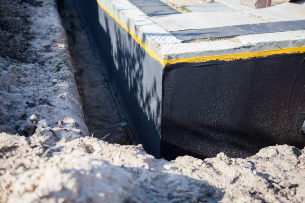 Professional Basement Waterproofing technician working in Baldwin, GA